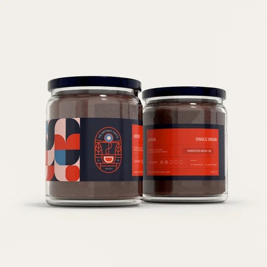 Two glass jars of single origin Kenyan coffee with modern geometric labels.