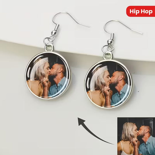 photo hanging earrings with a glass dome pendant